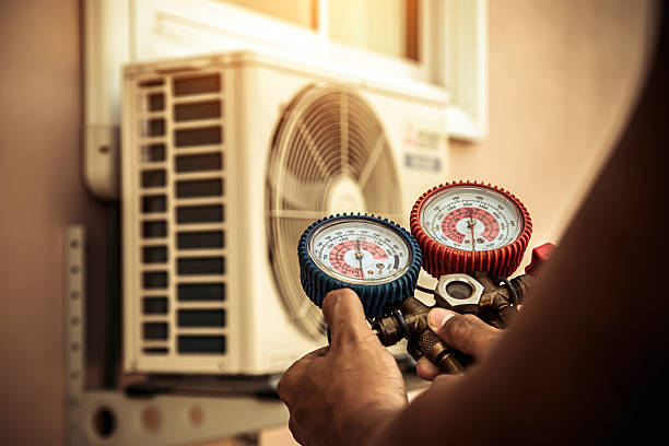 Professional Hvac technician working in Clay, AL